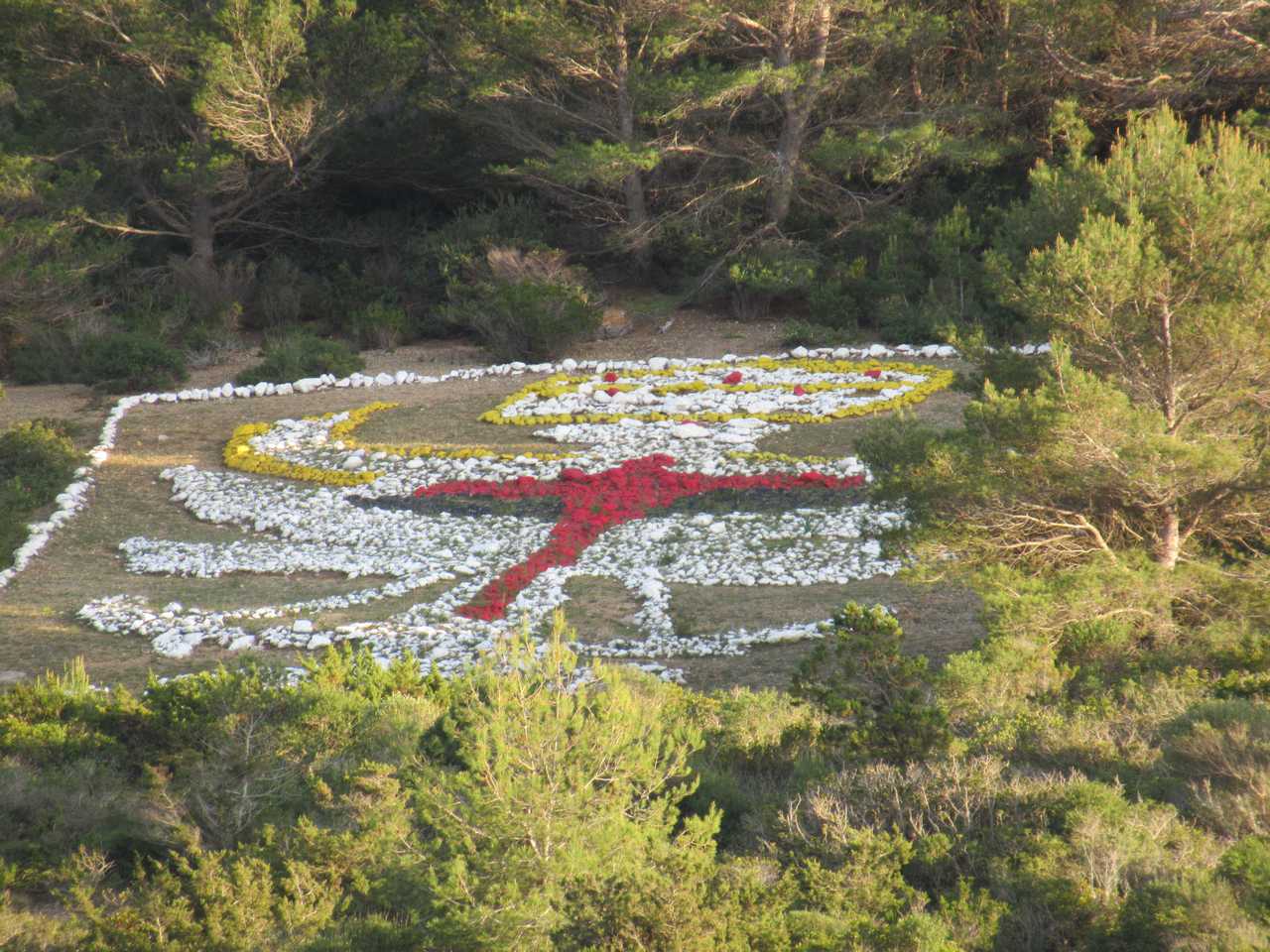 The hillsides are decorated by the military.