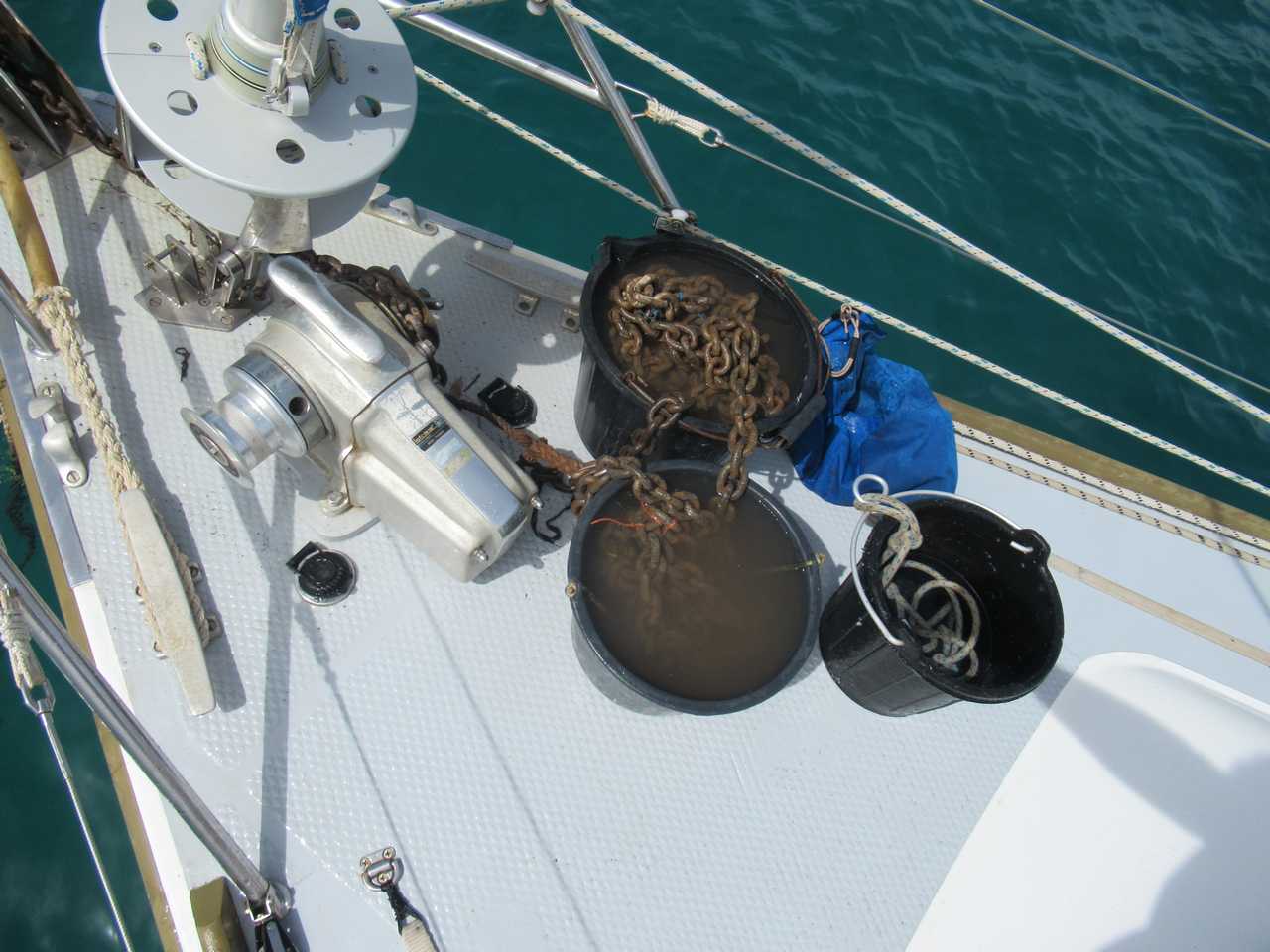 The yachting life is such a glamourous life. Cleaning the chain.