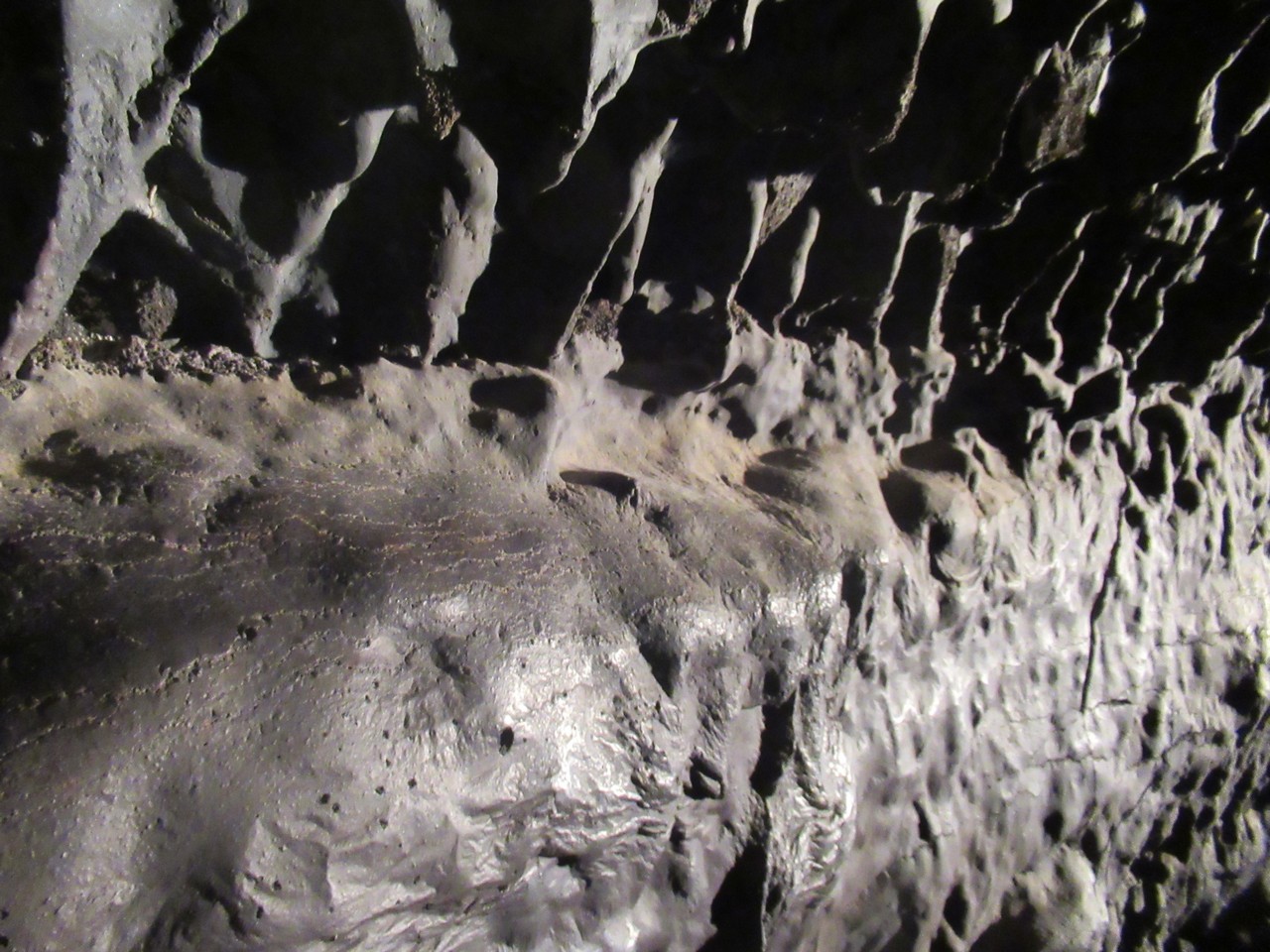 The lava slides down vertical surfaces.